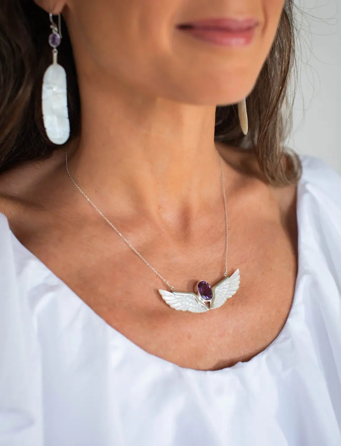 Amethyst Mother of Pearl Wings Necklace being worn